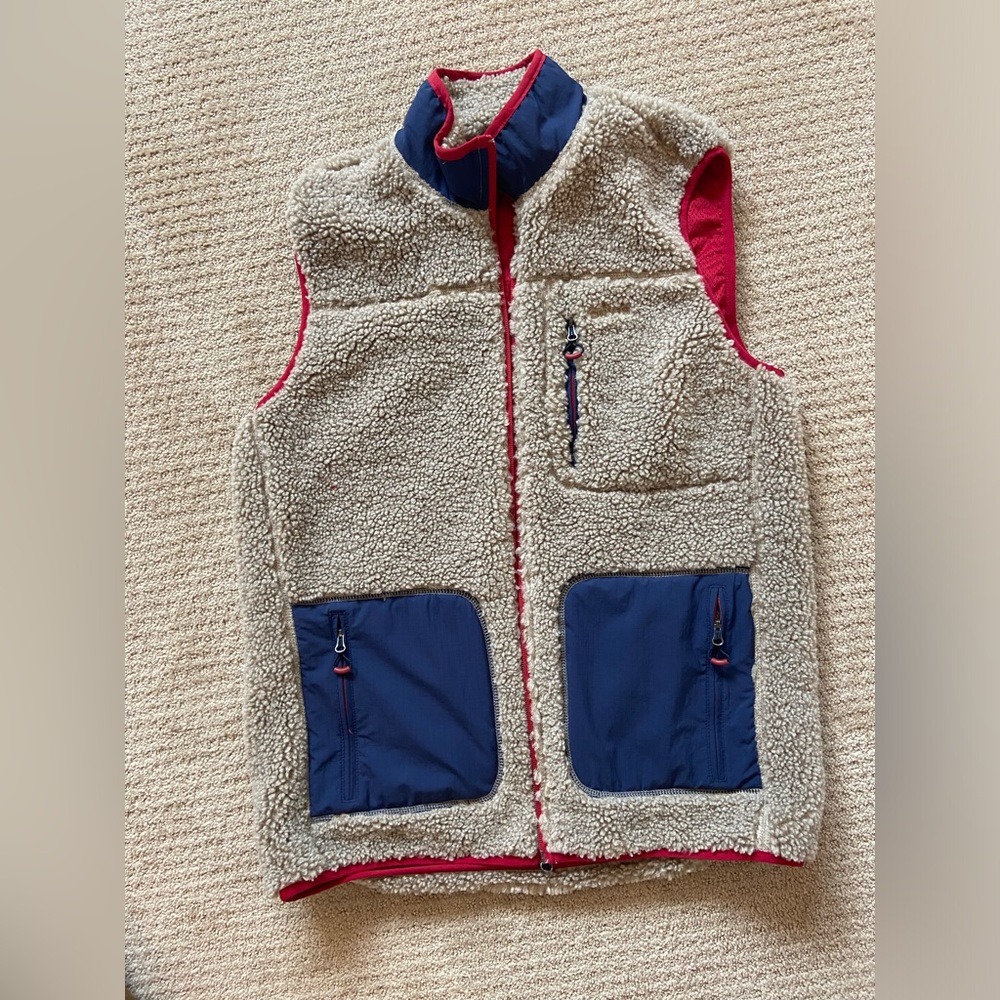 Tan and red with blue pockets Orvis vest. size medium.